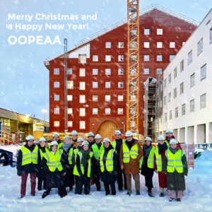A wintery image of the OOPEAA Team in front of the Seinäjoki Station complex under construction