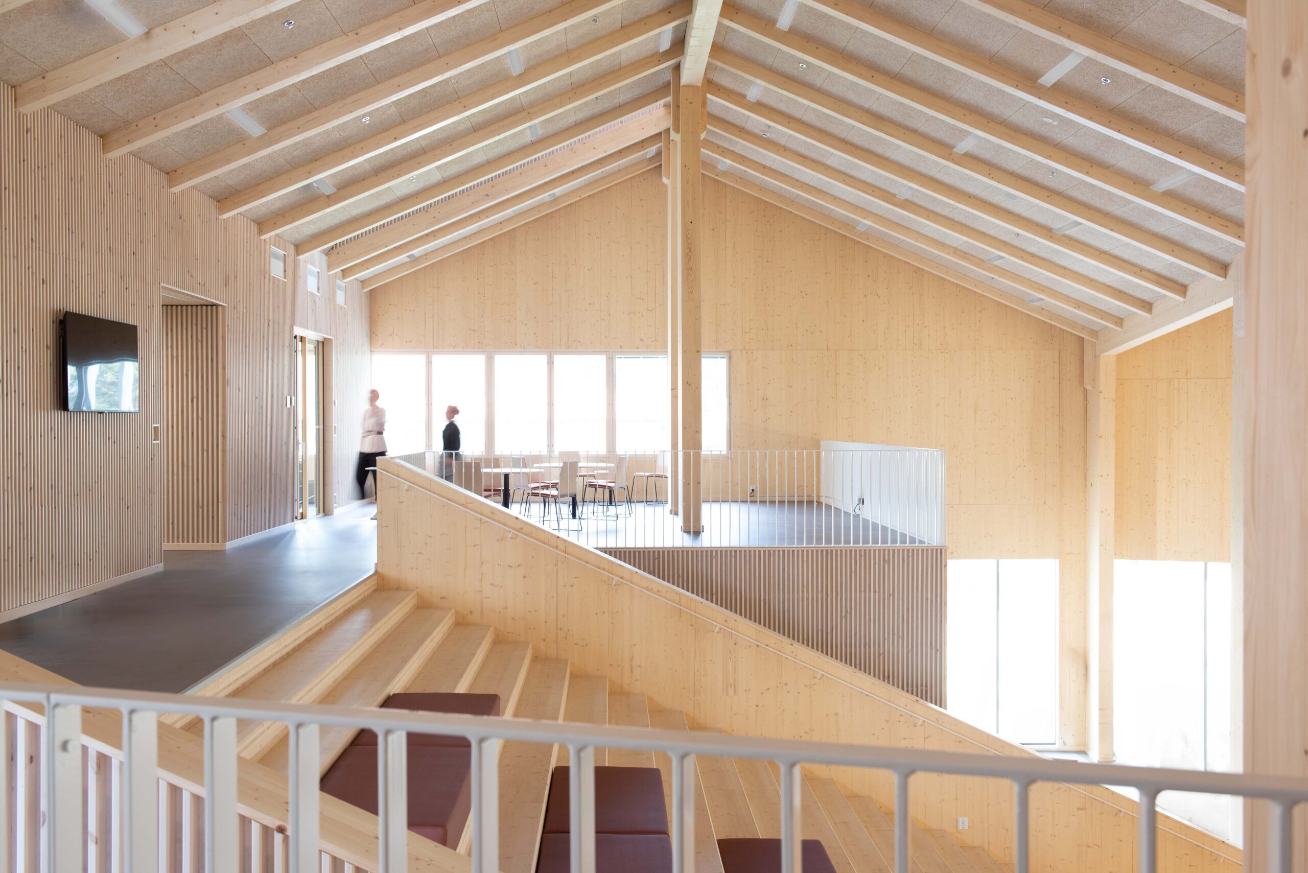 The large wooden stair in the middle forms the heart of the education building