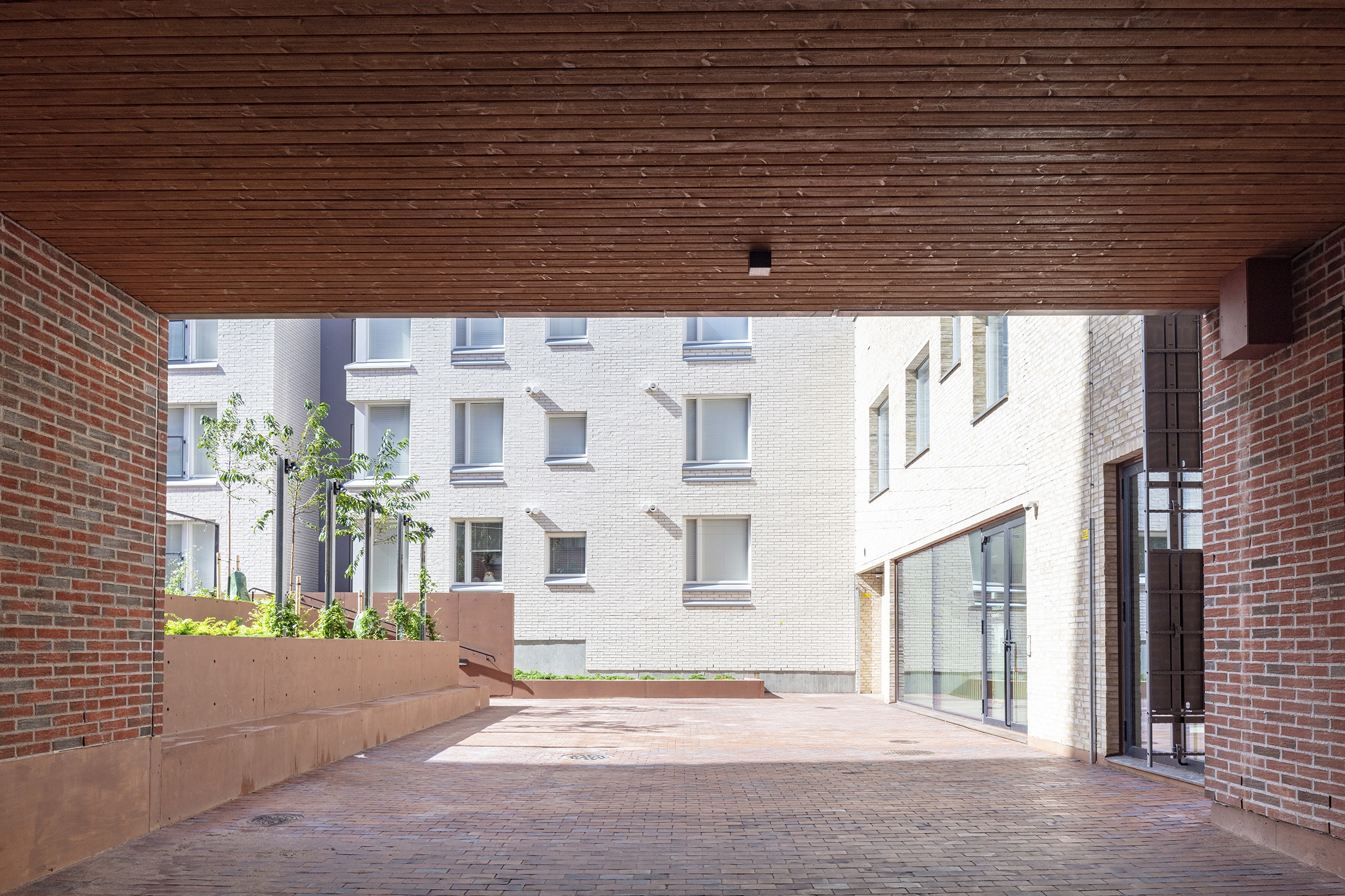Entrance from the street to the open yard space shared by the Tikkurila Church and the Bethania apartments and the community at large