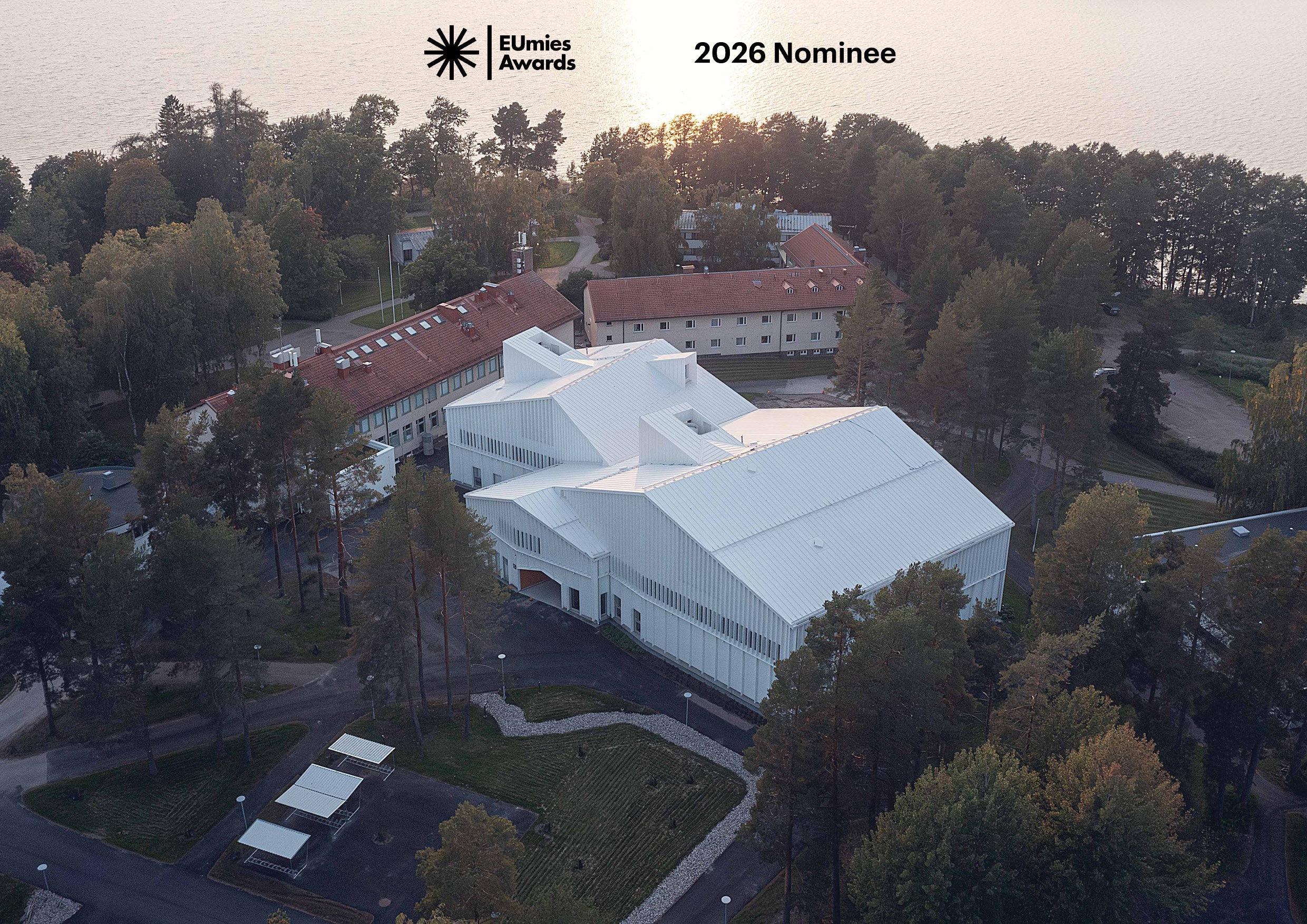 Aerial photo showing the Lastu Education Building on the campus by the lake