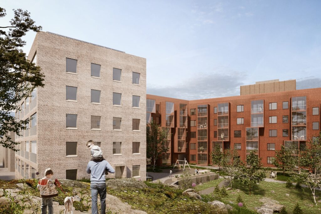 View showing the courtyard of an apartment block with a man with a child on his shoulders in the foreground