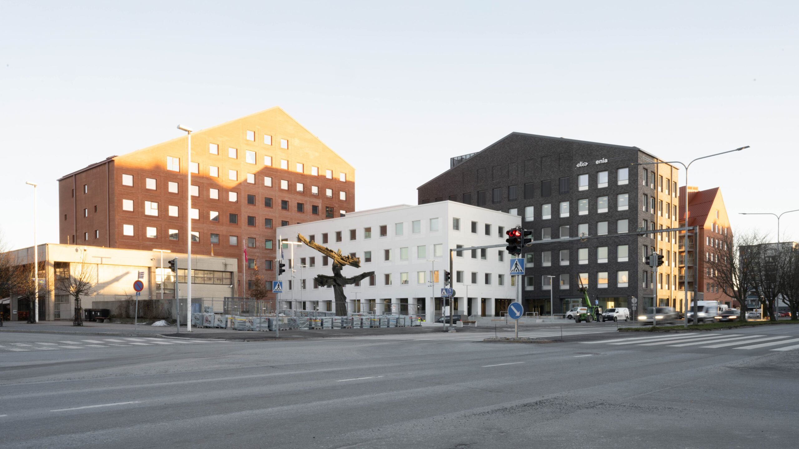 View of a block of buildings of different colors of brick of different sizes and heights
