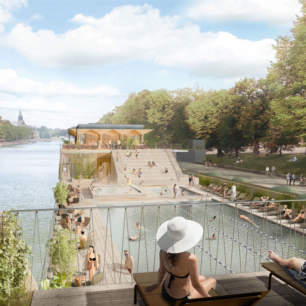 Person with a white sun hat sitting by a floating. pool on a river
